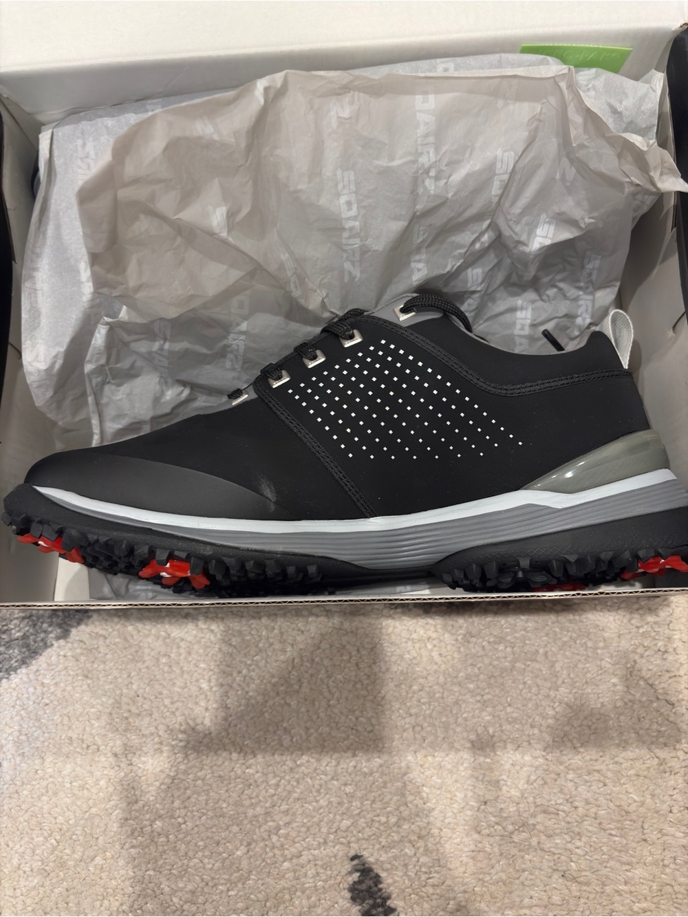 Brand new never worn Men's Black Athletic Golf Shoe with Red Outsole Accents